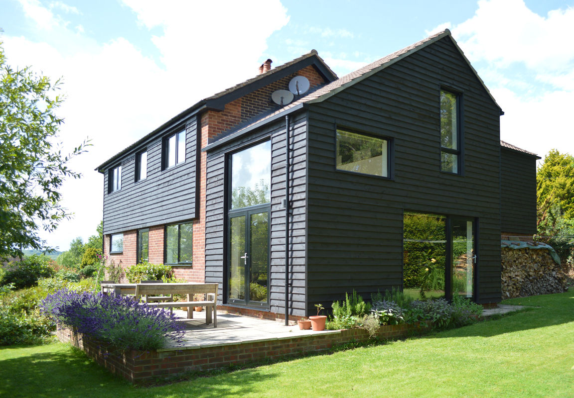 Extension & Refurbishment of 1960s House in West Sussex ArchitectureLIVE Modern houses Wood Wood effect timber cladding,extension,double-height window,full-height windows,feature window,insulated cladding,1960s home