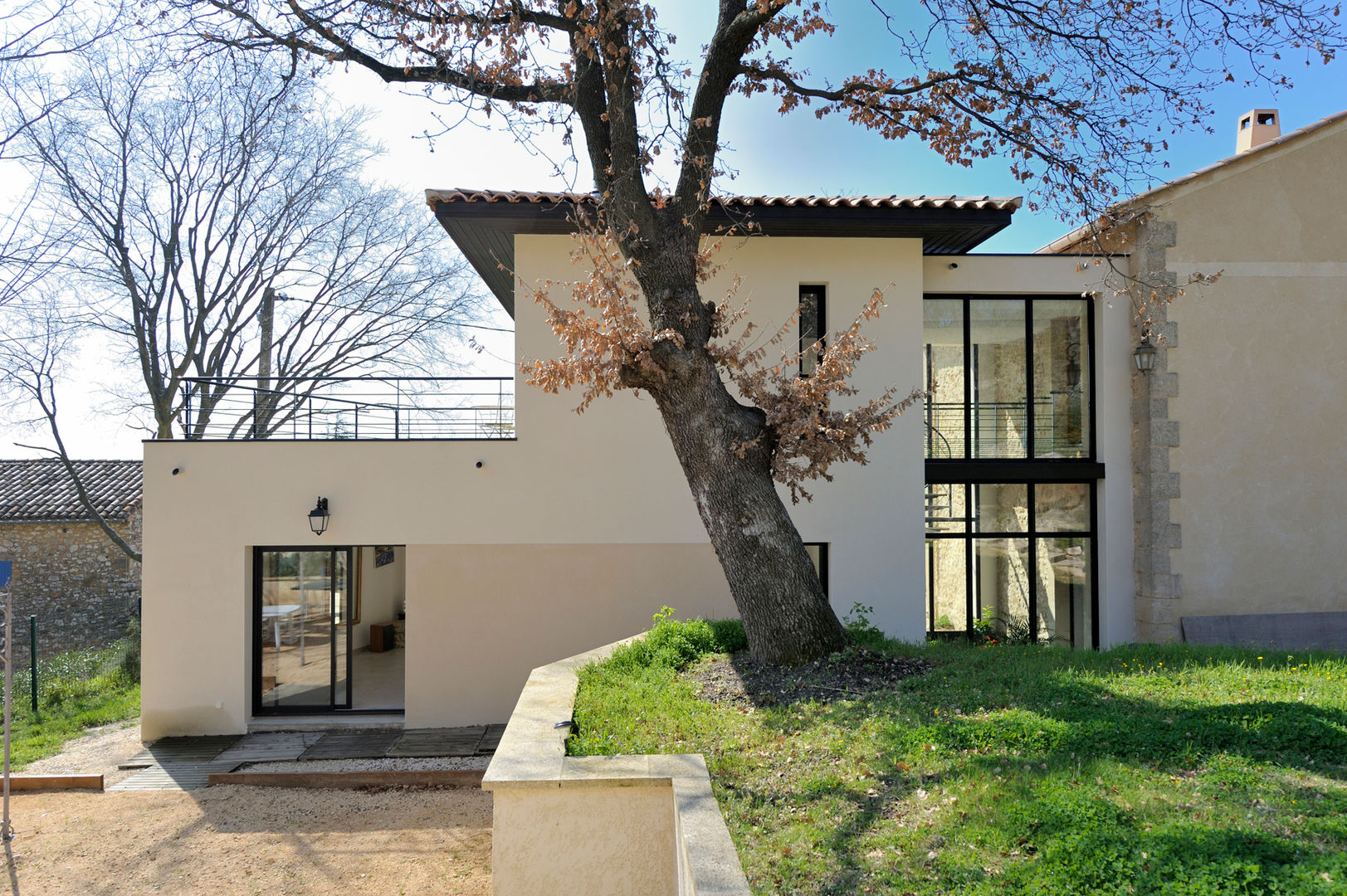 EXTENSION D'UNE MAISON, JOSE MARCOS ARCHITECTEUR JOSE MARCOS ARCHITECTEUR Jardines de invierno de estilo moderno