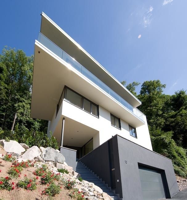 Modernes Einfamilienhaus mit reduzierter Formensprache, Atelier und Architekturbüro Bärenwald Atelier und Architekturbüro Bärenwald