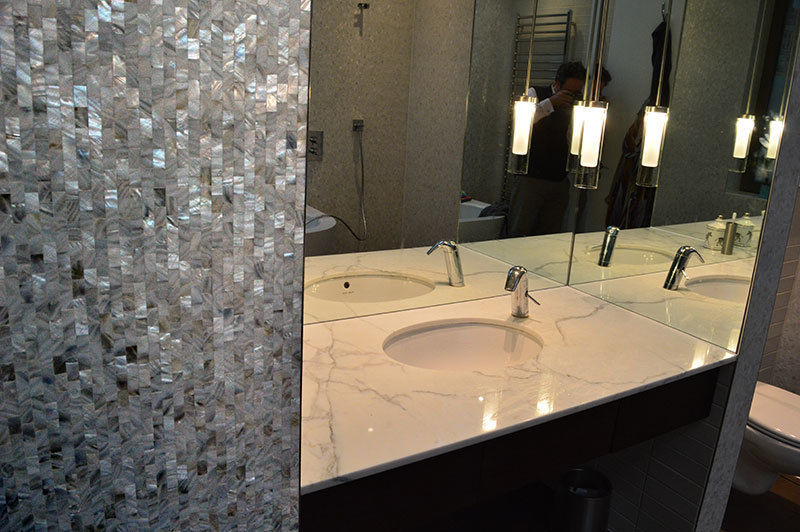 Seamless freshwater pure white mother of pearl used in the bathroom and kitchen of architect Timothy Crum's home. ShellShock Designs Modern Bathroom