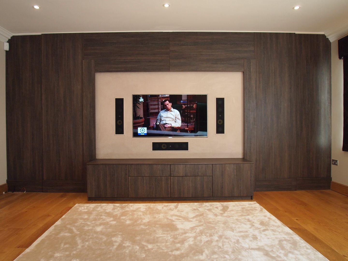Dual purpose audio visual media unit with concealed 9 feet cinema screen and wood panelled walls. Designer Vision and Sound: Bespoke Cabinet Making Modern media room Furniture