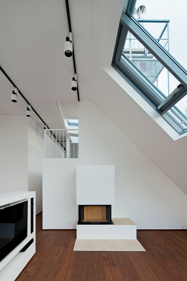 Penthouse K, t-hoch-n Architektur t-hoch-n Architektur Salones modernos