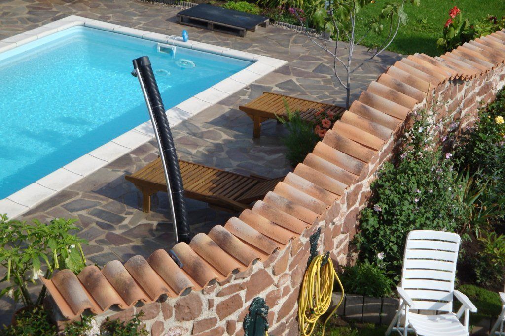 Mediterranes Flair für die Gartenmauer, Rimini Baustoffe GmbH Rimini Baustoffe GmbH حديقة