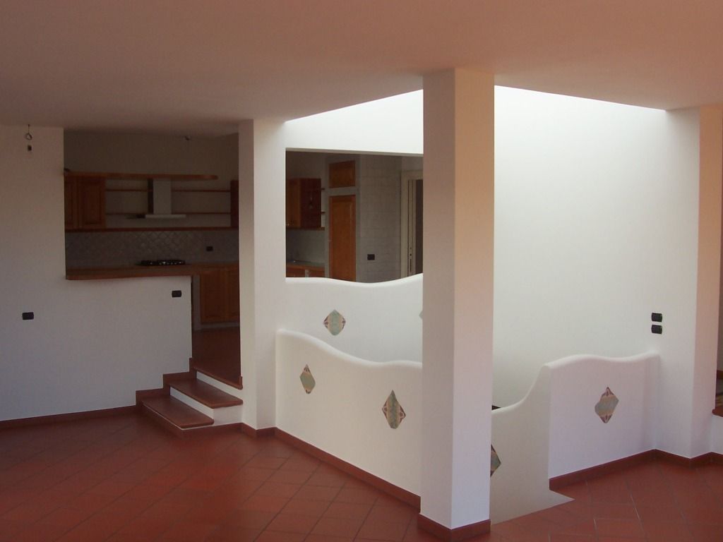 Abitazione a due livelli con giardino, Gianluca Vetrugno Architetto Gianluca Vetrugno Architetto Salones modernos