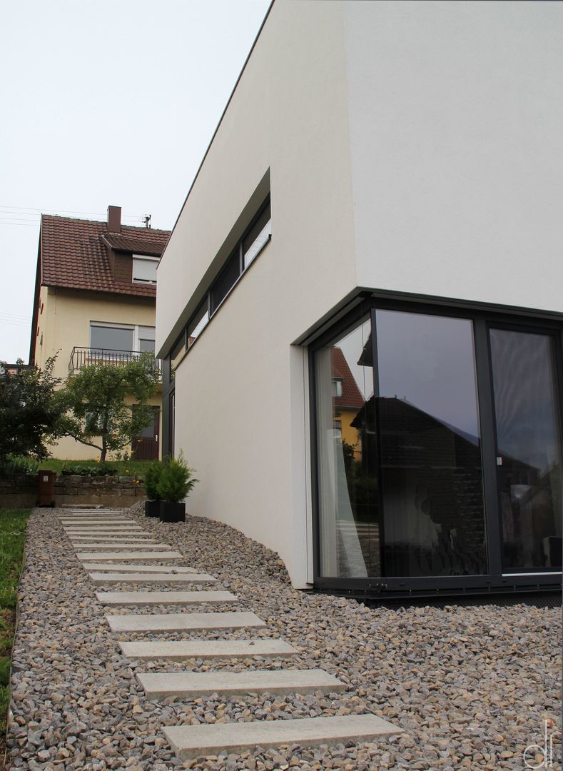 Raffiniertes Einfamilienhaus mit Pultdach, di architekturbüro di architekturbüro Casas de estilo minimalista