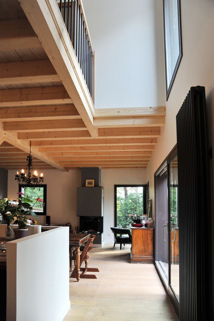 Maison Ossature bois à Oullins, Empreinte Constructions bois Empreinte Constructions bois モダンデザインの リビング