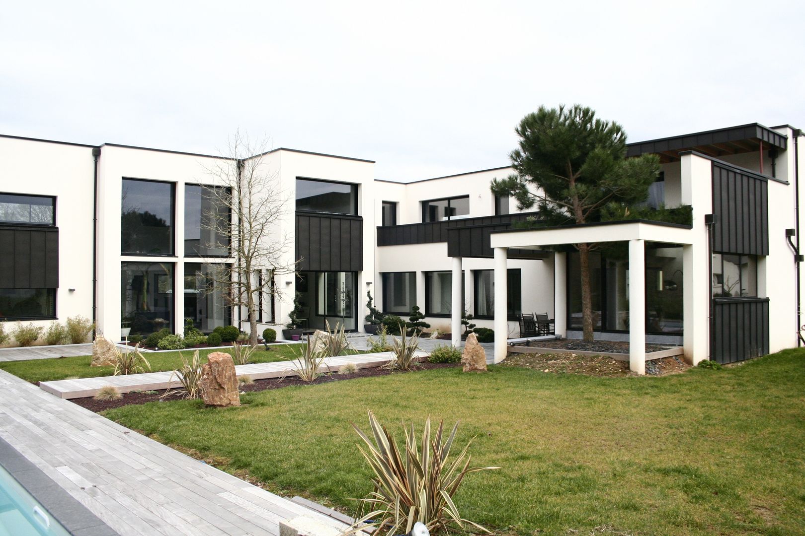 Maison à Campigny (27), scp duchemin melocco architectes scp duchemin melocco architectes Jardines de estilo moderno
