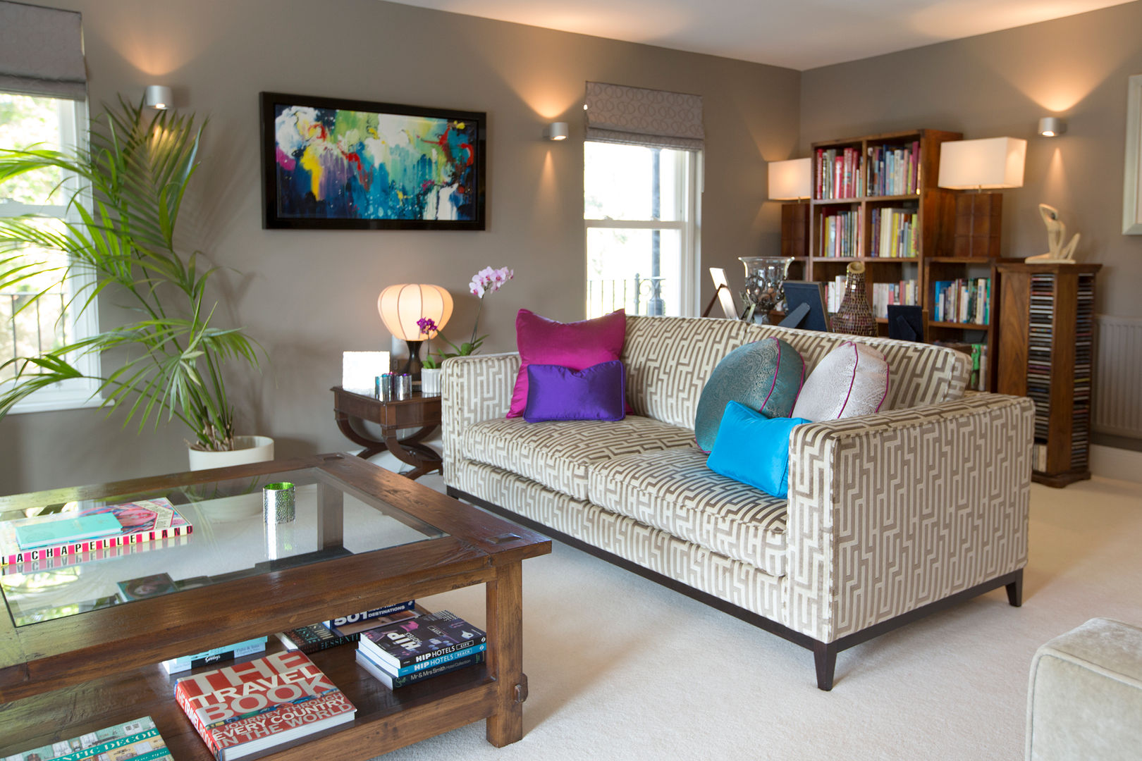 Neutral with Splashes of Jewel Colours in the Cushions and Art Design by Deborah Ltd Salas modernas