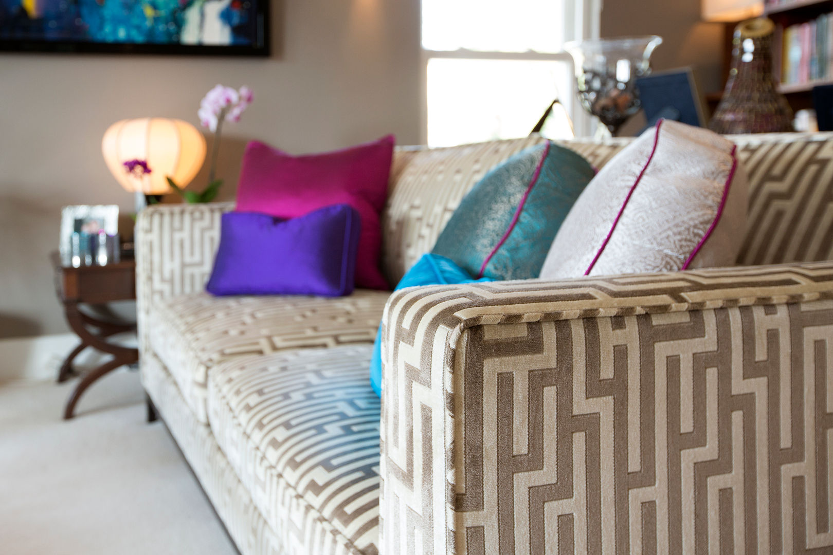 Stunning Geometric Fabric with Jewel Coloured Piped Cushions Design by Deborah Ltd Гостиная в стиле модерн Диваны и кресла