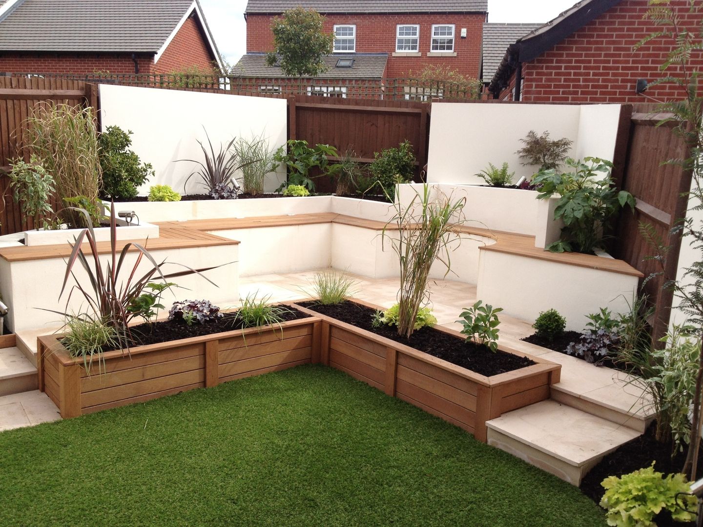 Integral bench seating/storage Lush Garden Design Modern garden