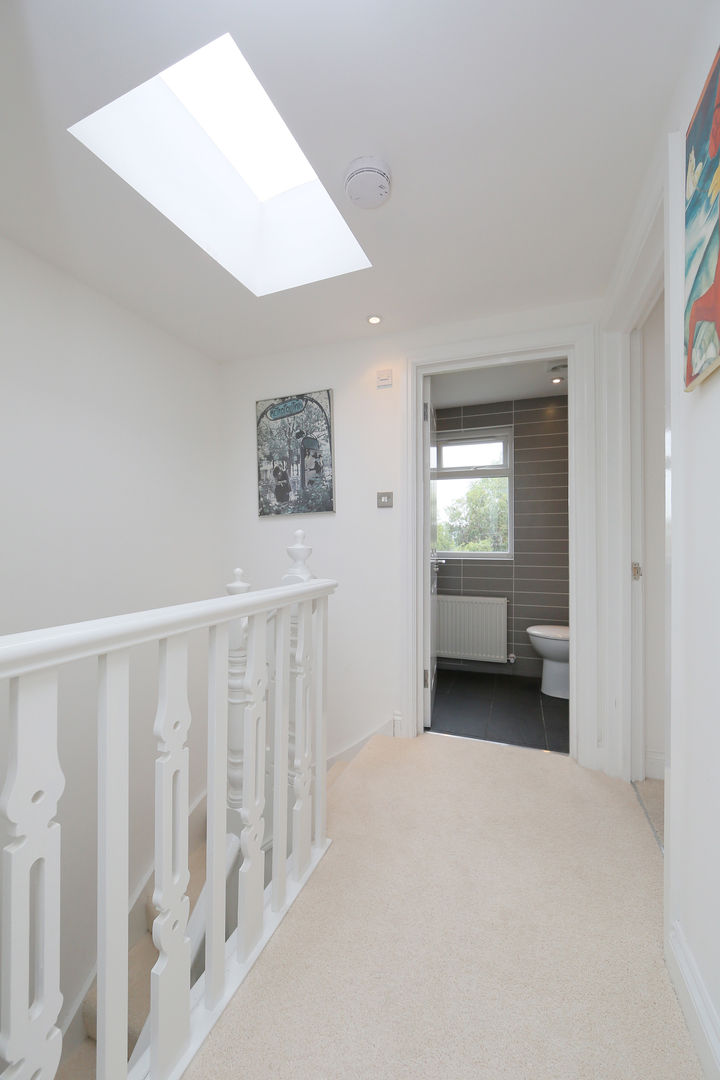 ​hip to gable loft conversion wimbledon homify الممر الحديث، المدخل و الدرج