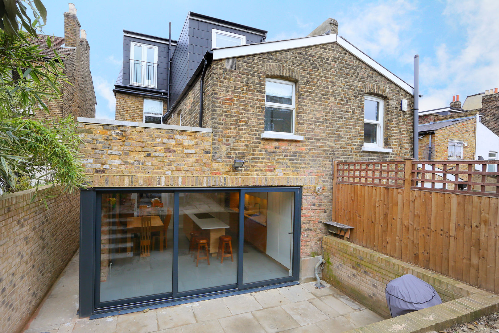 ​kitchen extension dulwich with flat roof and open brickwork homify Casas modernas