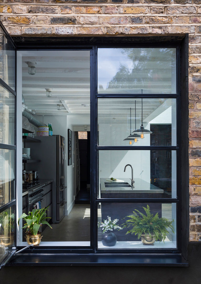 View through window to kitchen Mustard Architects Endüstriyel Evler