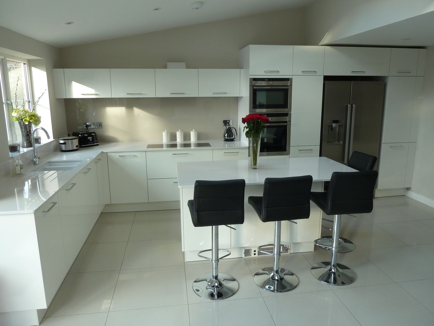 High gloss white with Silestone Blanco Norte worktops Zara Kitchen Design Modern style kitchen