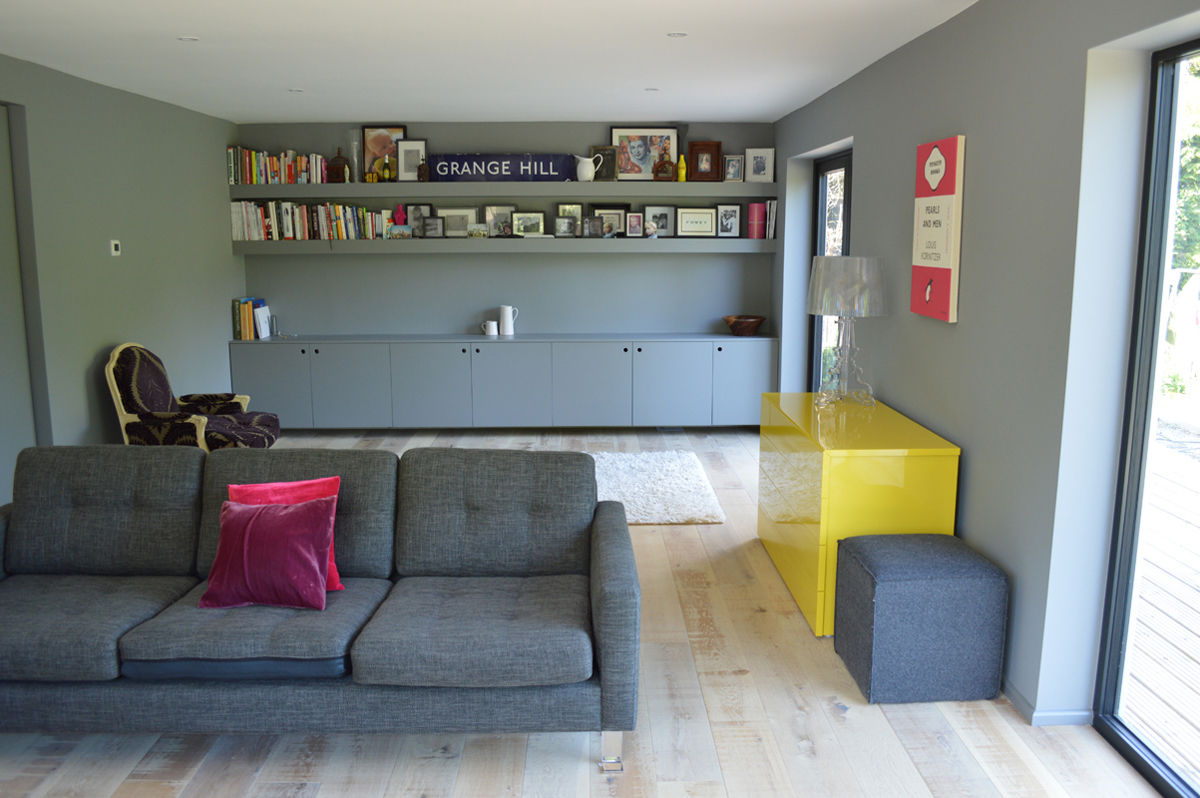 The Living Room features Built-In Storage and Shelving ArchitectureLIVE Modern living room grey sofa,living room,timber flooring,built-in storage,yellow accent,underfloor heating