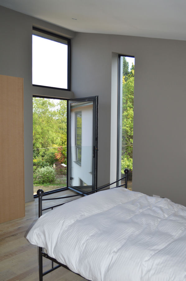 The Master Bedroom features a Juliet balcony ArchitectureLIVE Modern terrace master bedroom,juliet balcony,glass balustrade,full height glazing