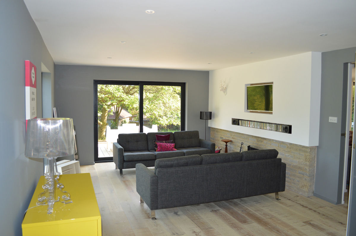 New patio doors in the Living Room look out to the Southerly Garden ArchitectureLIVE Modern living room living room,timber flooring,grey sofa,1960s fireplace,patio doors,yellow accent,underfloor heating