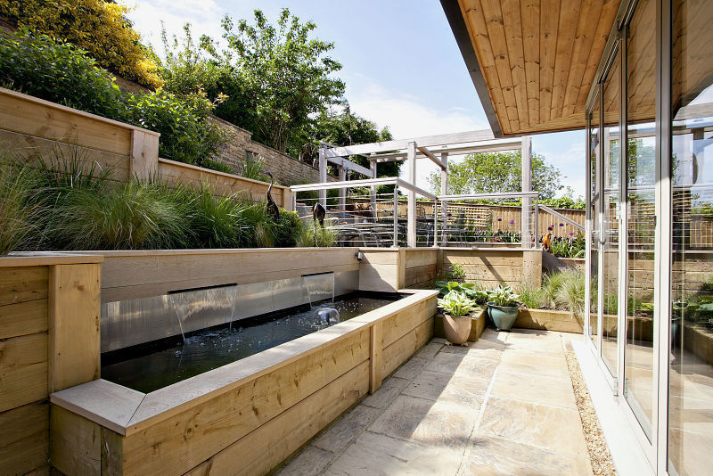 Steeply sloping garden with decked terraces Susan Dunstall Landscape & Garden Design