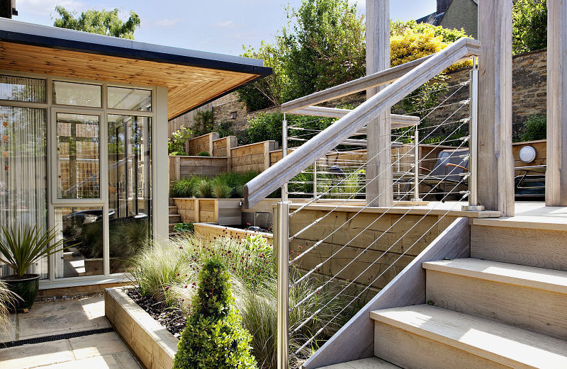 Steeply sloping garden with decked terraces Susan Dunstall Landscape & Garden Design