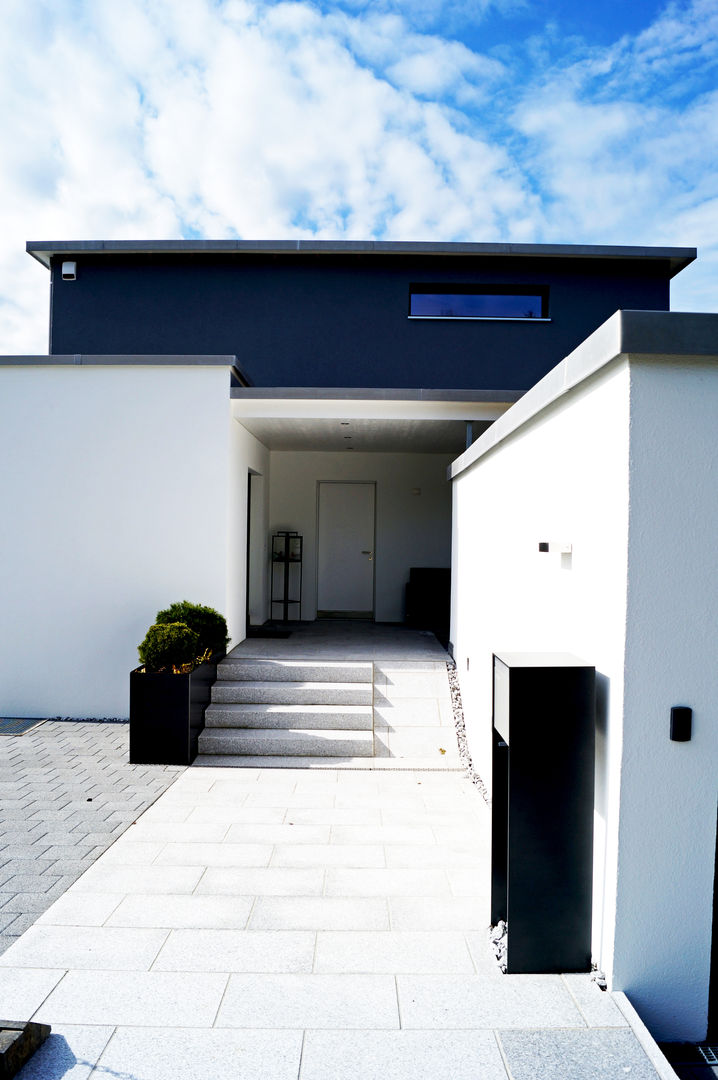 Kubisches Einfamilienhaus mit inspirierendem Interieur, Füglistaller Architekten AG Füglistaller Architekten AG Будинки