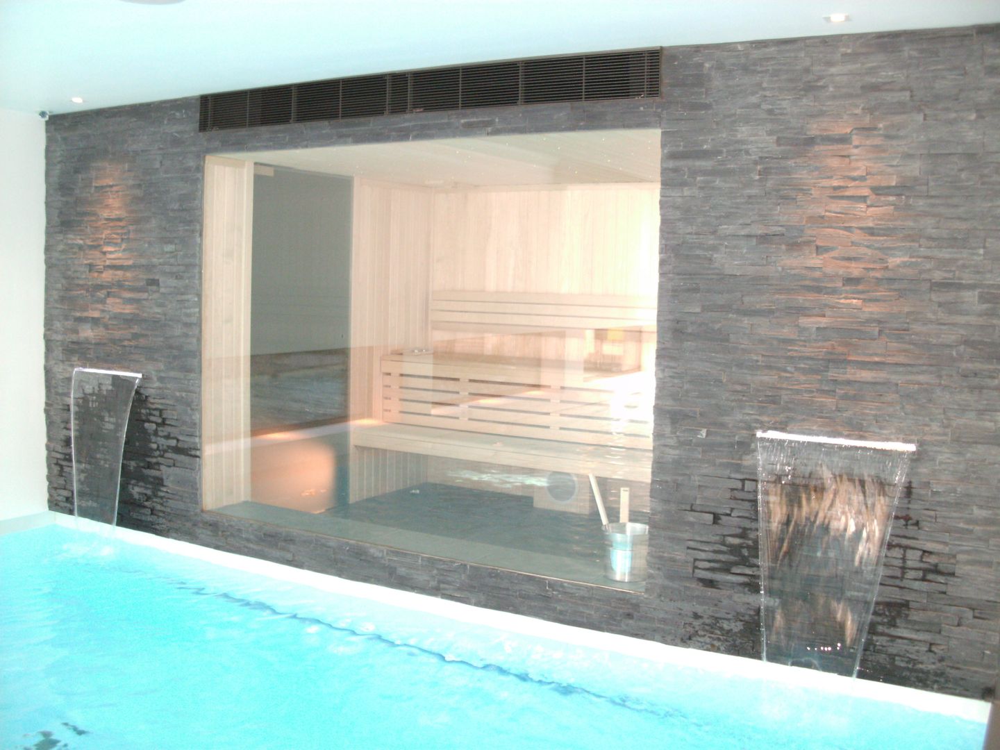 Indoor pool with waterfall features, sauna and stainless steel spa, Tanby Pools Tanby Pools Modern Pool