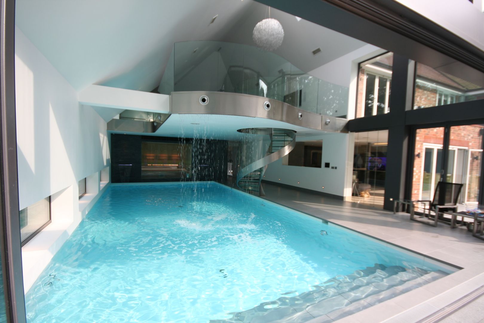 Indoor pool with waterfall features, sauna and stainless steel spa, Tanby Pools Tanby Pools Pool