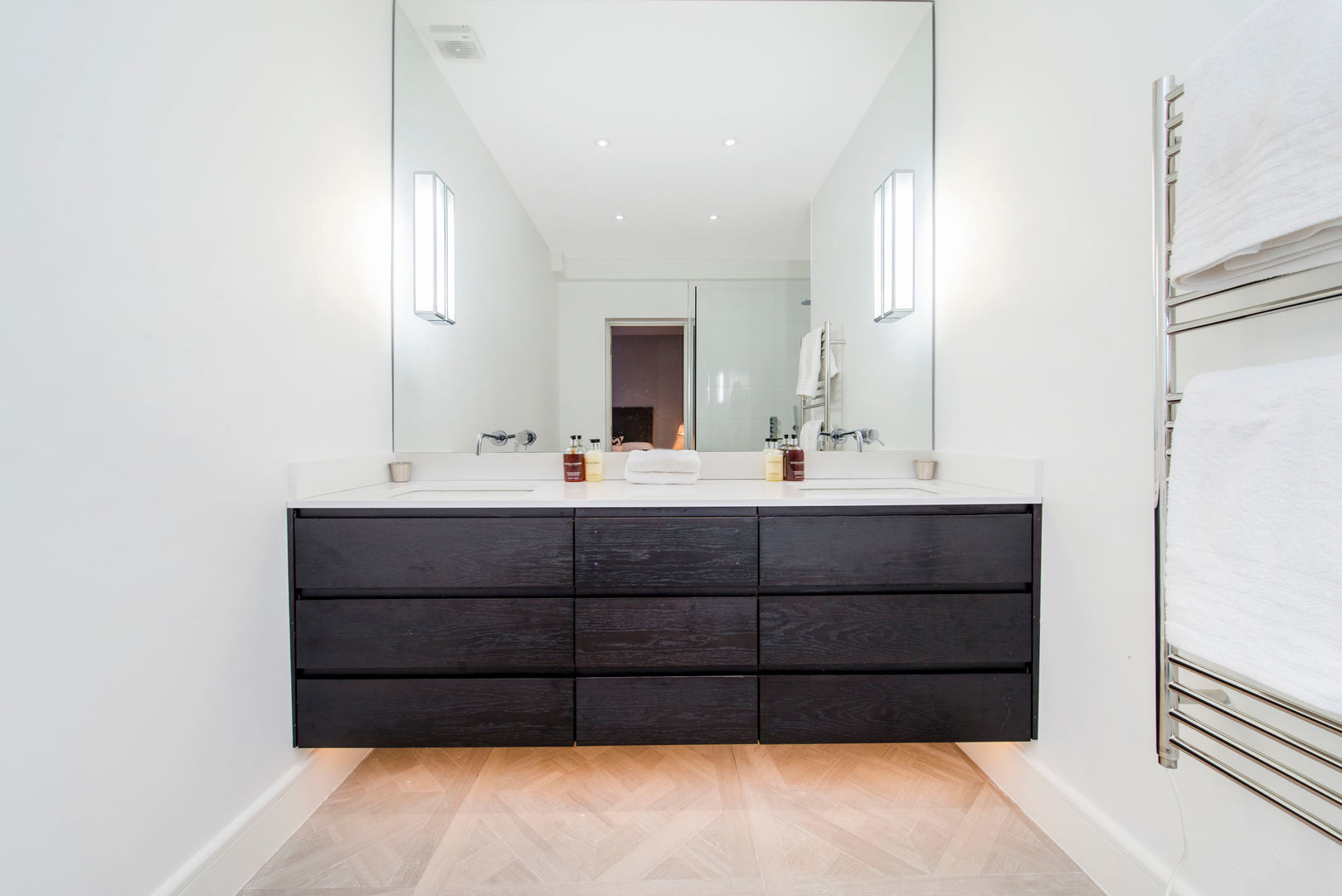Parquet flooring and underlit counters Balance Property Ltd Phòng tắm phong cách hiện đại