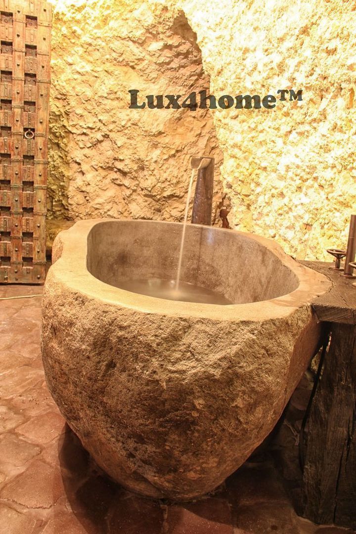 homify Country style bathroom Stone Bathtubs & showers