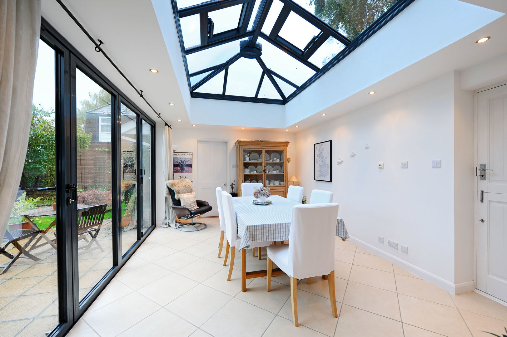 Orangery from kitchen with bi folding doors homify Modern conservatory