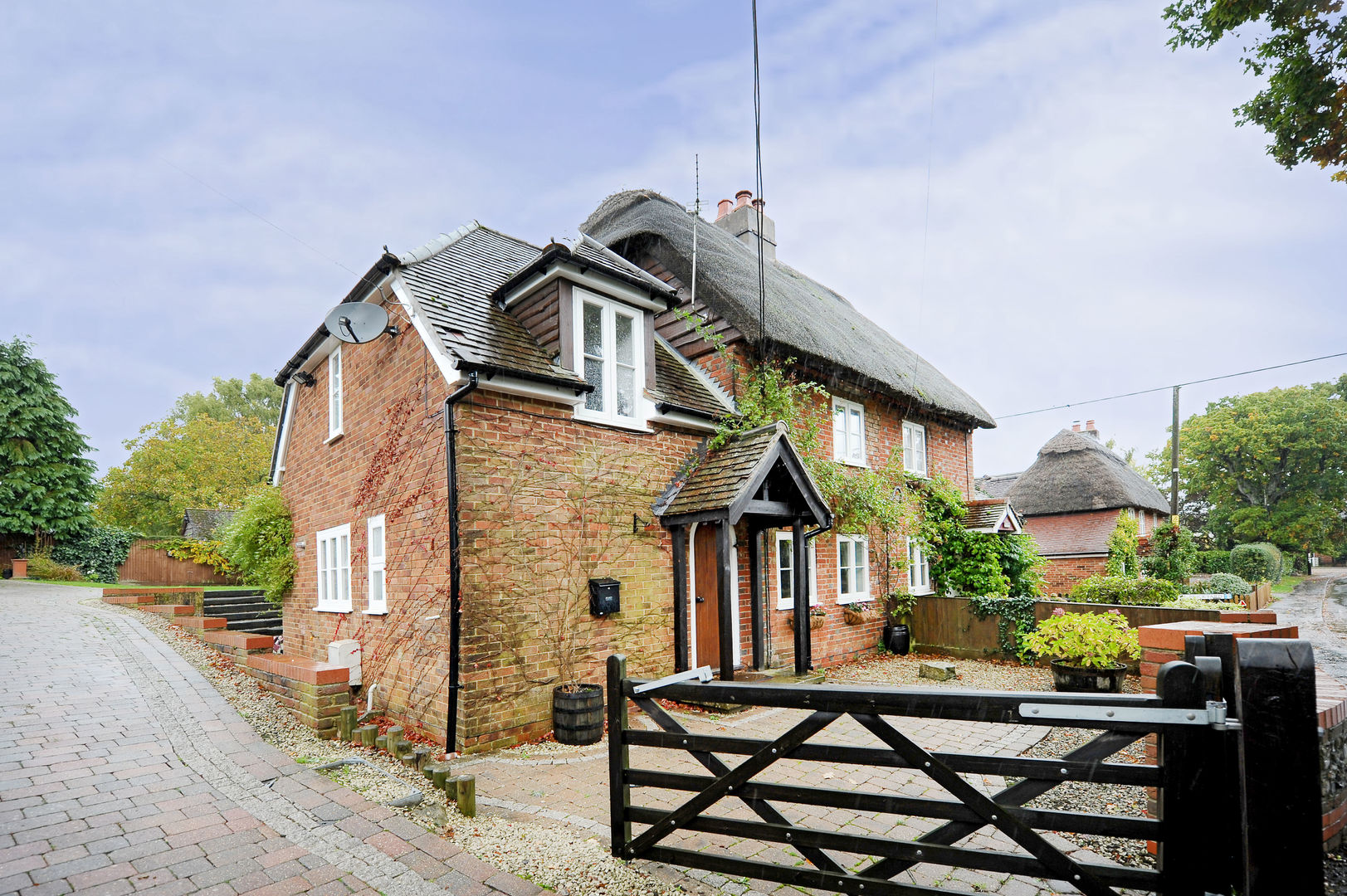 Thatch Cottage with Storm Evolution homify Rustic style windows & doors