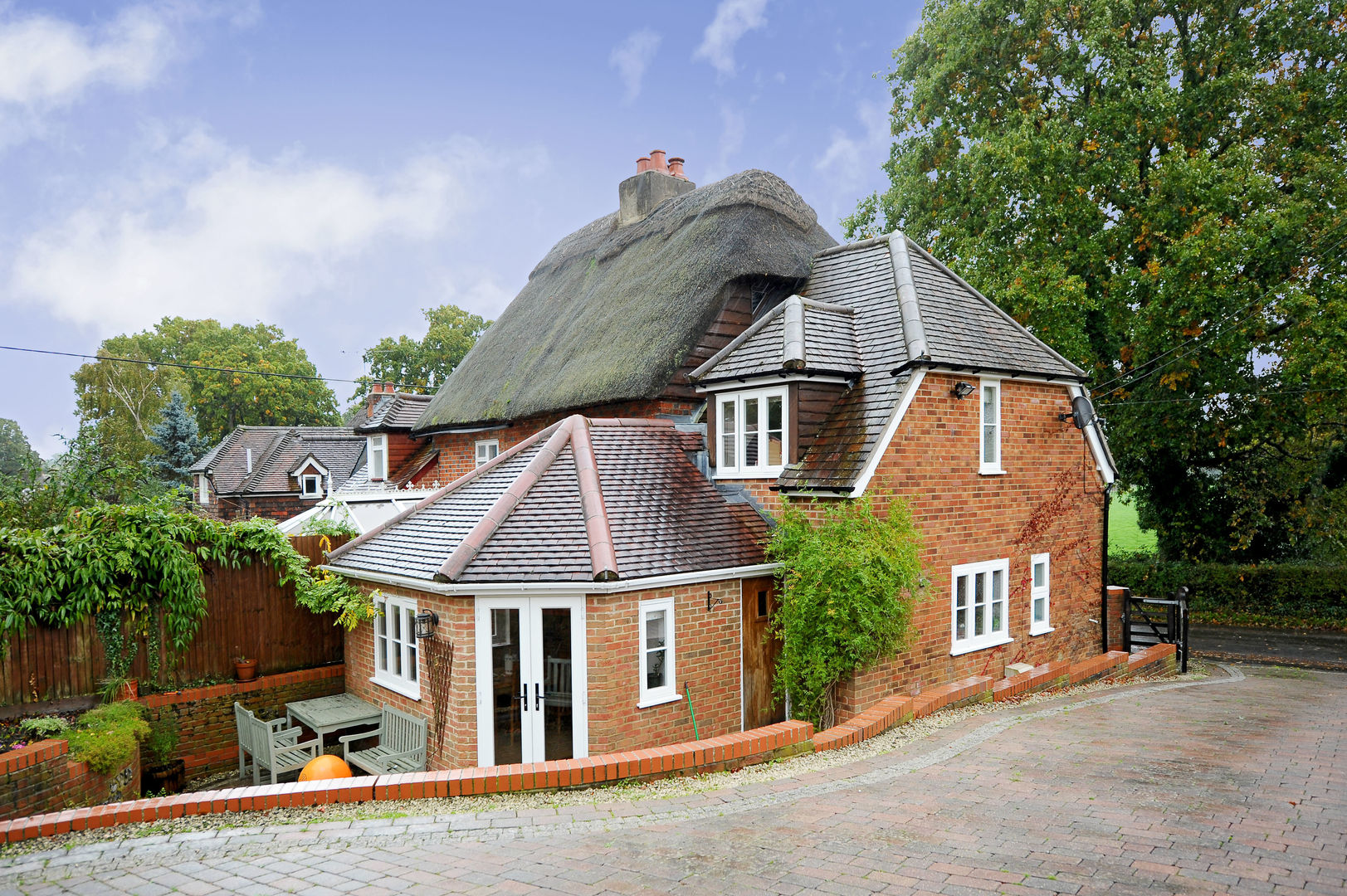 Thatch Cottage with Storm Evolution homify Windows