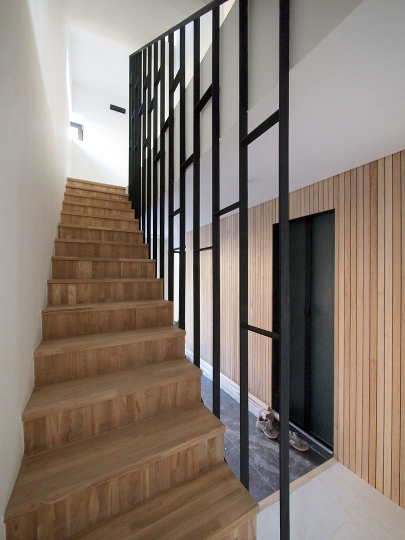 homify Modern corridor, hallway & stairs