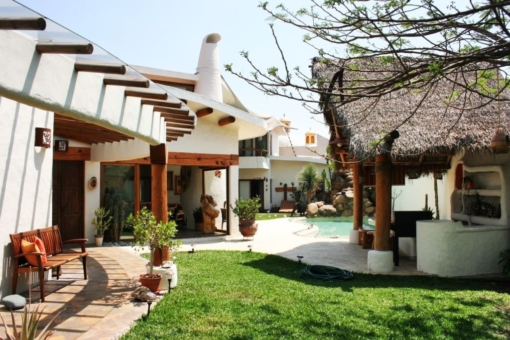 Jardín con Palapa Cenquizqui Jardines de estilo rural