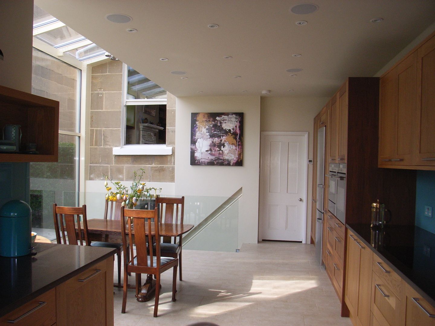 Modern Open-Plan Kitchen in Glass Extension Style Within Modern kitchen Wood Wood effect open plan kitchen,kitchen diner,glass extension,glass conservatory,garden room,oak veneer kitchen,walnut kitchen,porcelain tile floor,basement acess,quartz worktop