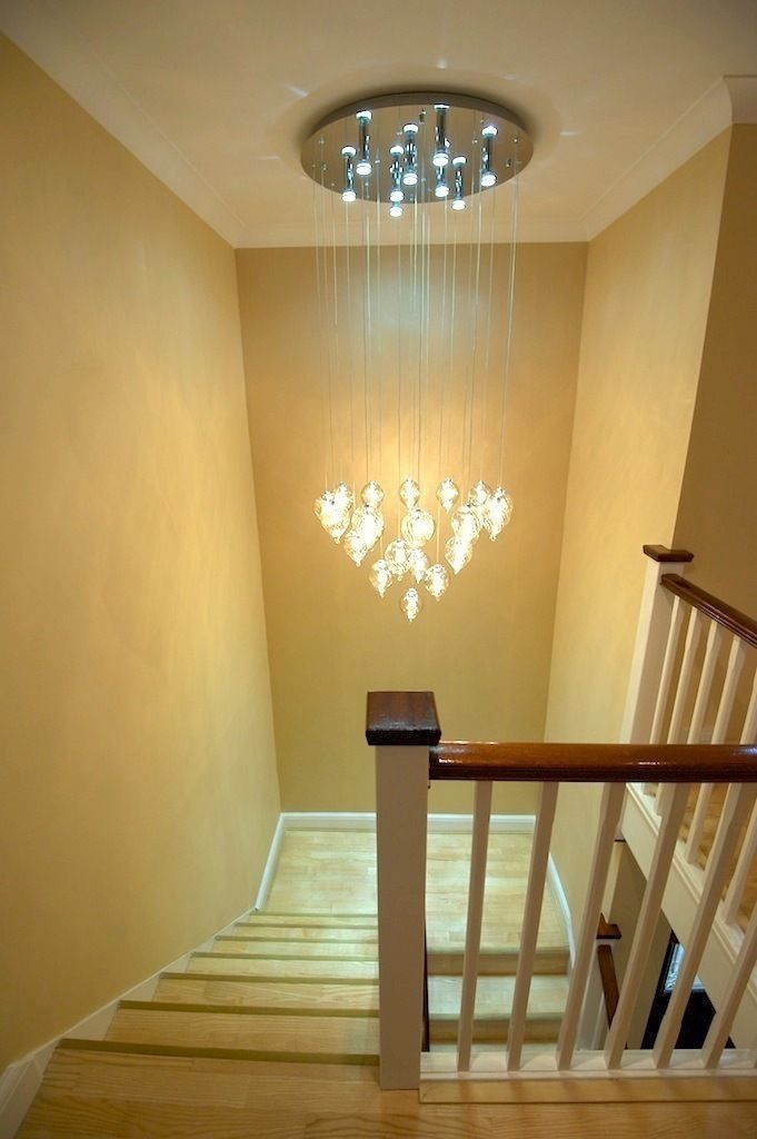 Statement light over staircase Chameleon Designs Interiors Modern Corridor, Hallway and Staircase Lighting