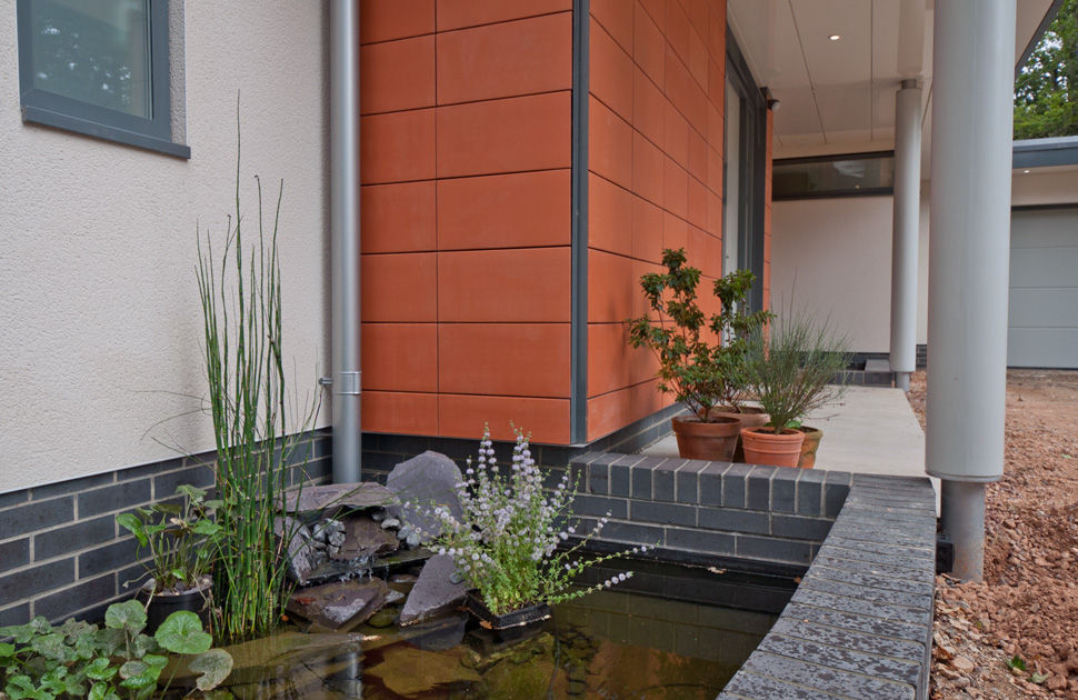 Greensleeves Entrance and Fish Pond DUA Architecture LLP Modern home