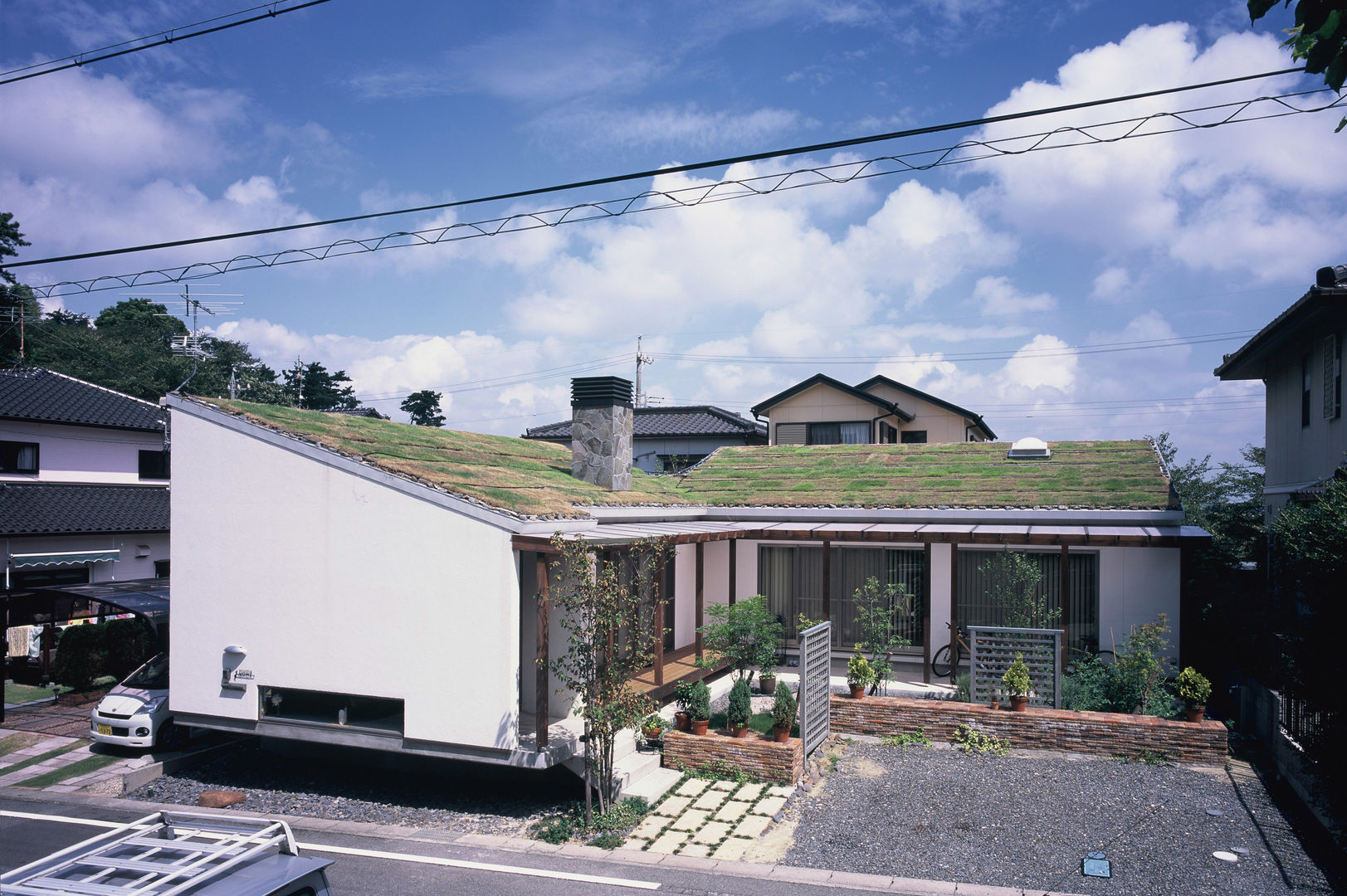 全景 小栗建築設計室 ラスティックな 家 石