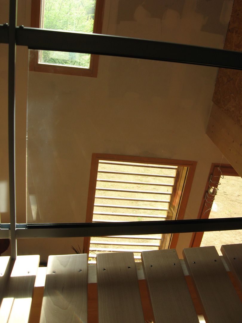 Maison bioclimatique près de l'étang à Mézières sur Couesnon, Catherine DANIEL Architecte Catherine DANIEL Architecte Modern Corridor, Hallway and Staircase