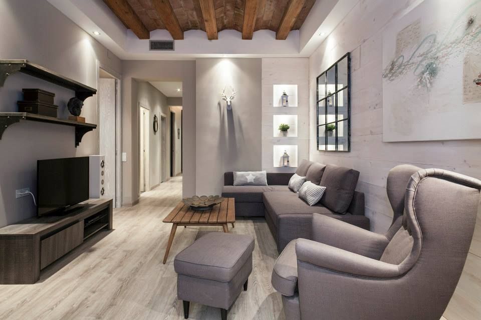 APARTAMENTO EIXAMPLE DE BARCELONA, Time2dsign Time2dsign モダンデザインの リビング