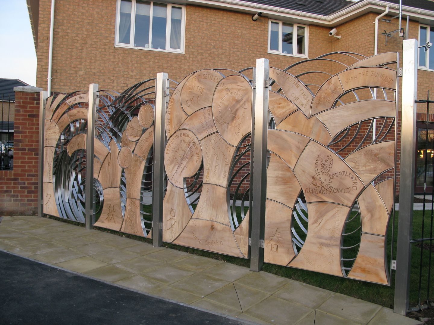 Stainless Steel Artistic Fence with wood infill Aycliffe Fabrications Ltd