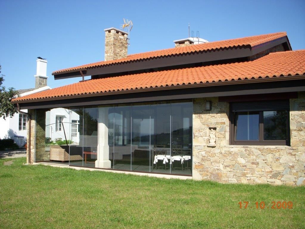 Vivienda unifamiliar en Pombal. Cabanas. A Coruña., DE DIEGO ZUAZO ARQUITECTOS DE DIEGO ZUAZO ARQUITECTOS Rustic style house