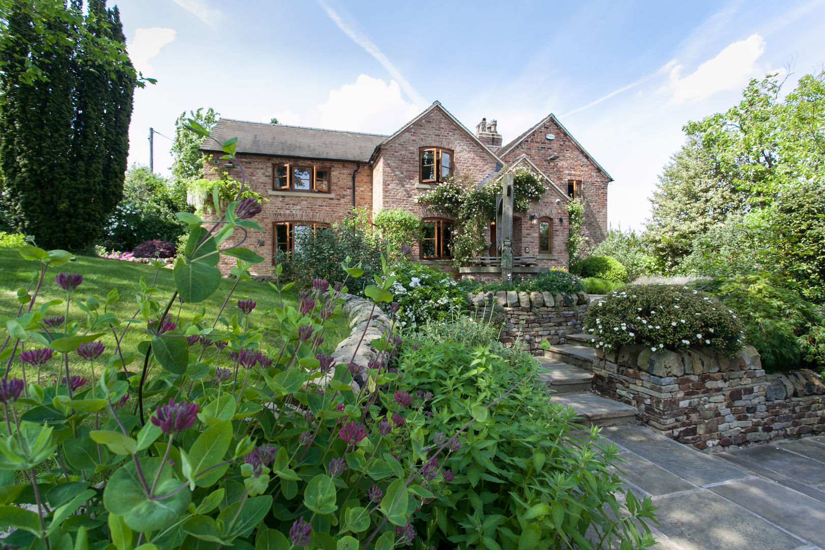 English cottage garden style planting and hard materials Barnes Walker Ltd Garden