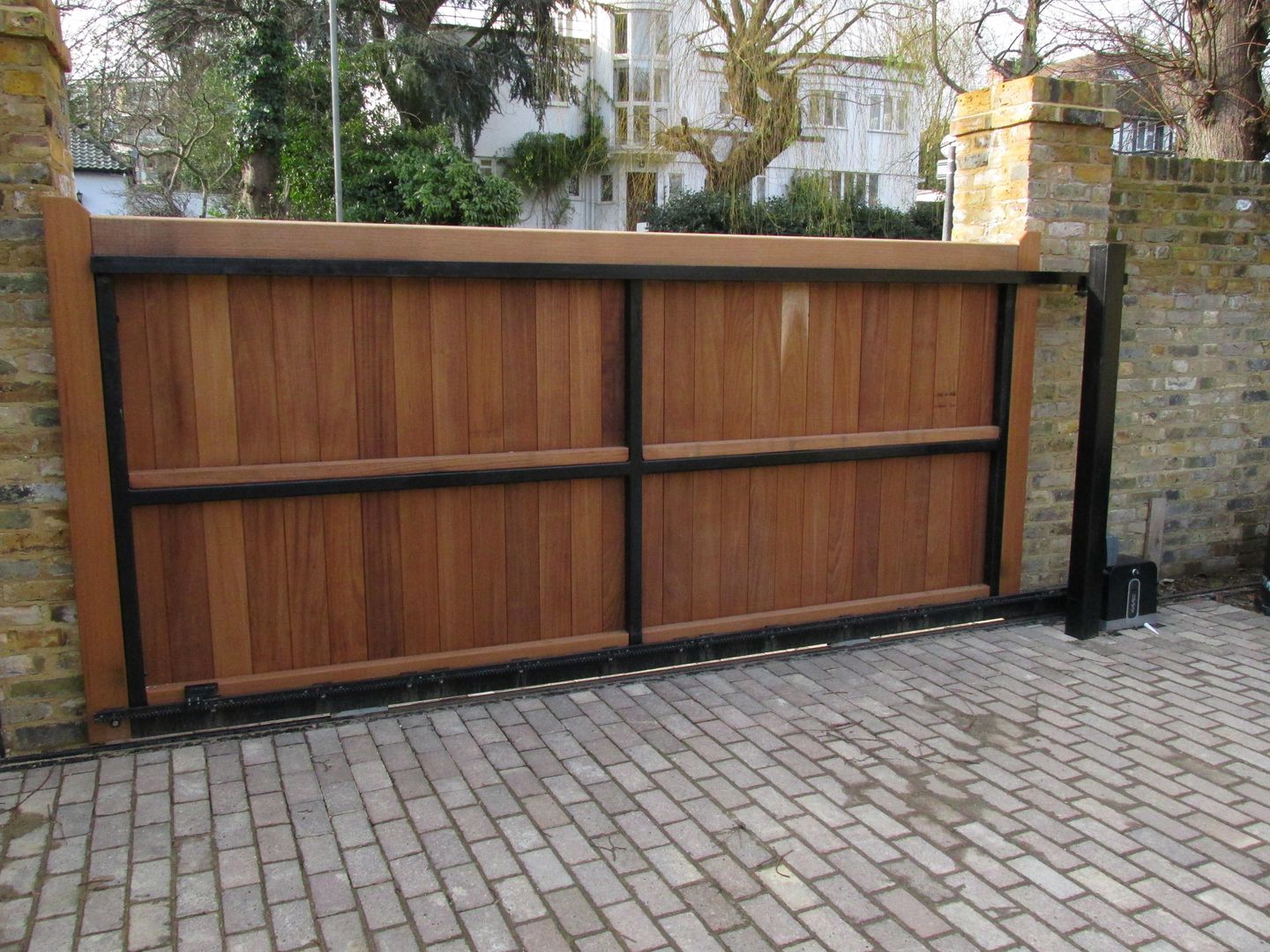 Rear View of Metal Framed, Wooden Boarded Electric Gate Portcullis Electric Gates Mediterranean style garden