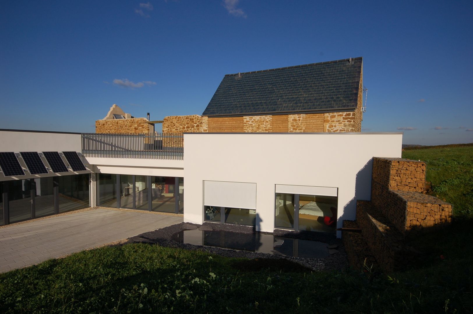 External Roller Blind Installation on England's first certified Passivhaus in Warwickshire. homify Modern windows & doors Blinds & shutters