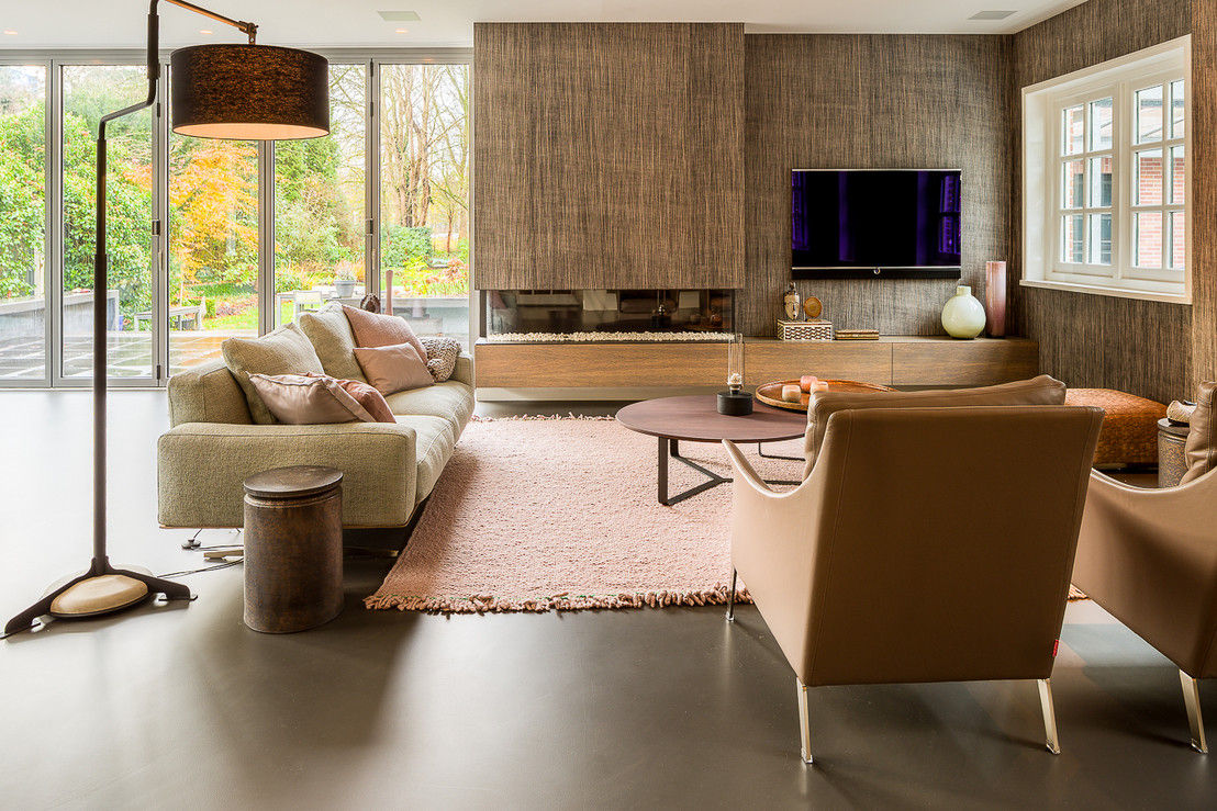 Woonkamers met een gietvloer, Design Gietvloer Design Gietvloer Salas de estar modernas