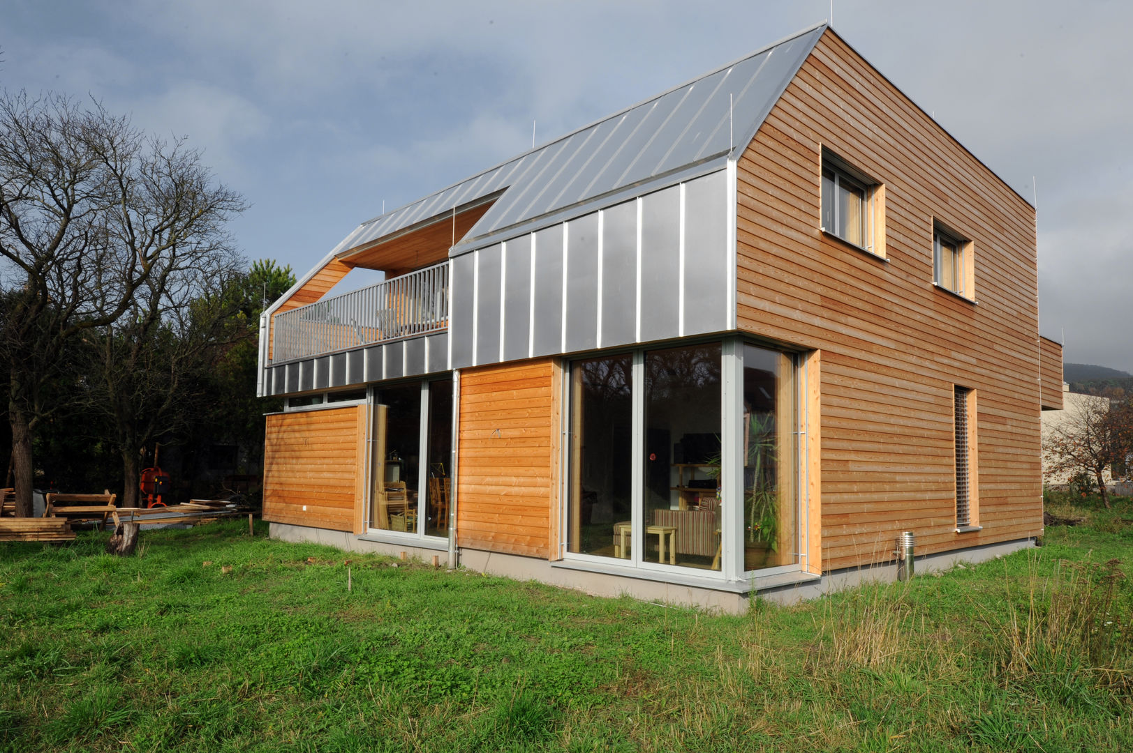 Niedrigstenergie - Einfamilienhaus in Brettstapelbauweise in Bad Vöslau (A), Symbios Architektur Symbios Architektur Casas de estilo moderno Madera Acabado en madera