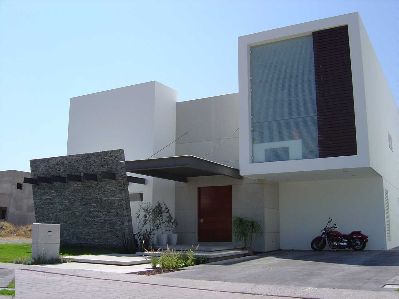 Fachada homify Casas estilo moderno: ideas, arquitectura e imágenes Piedra