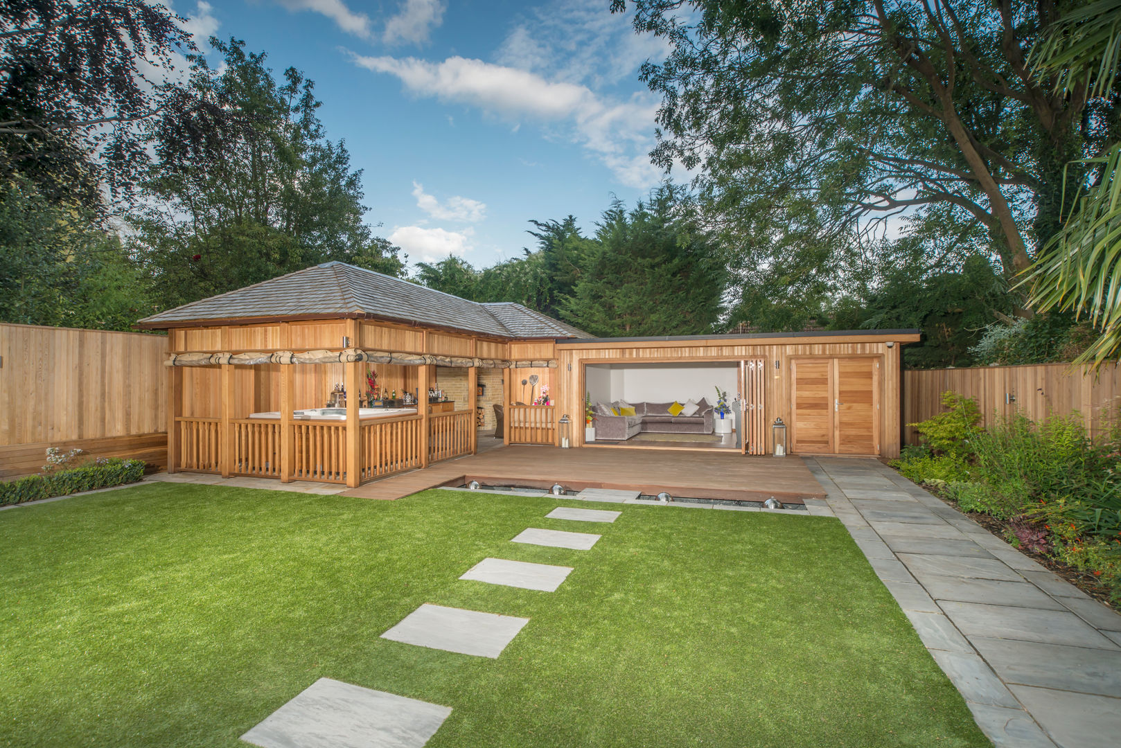 Bespoke garden building complete with spa and kitchen Crown Pavilions Garage/shed