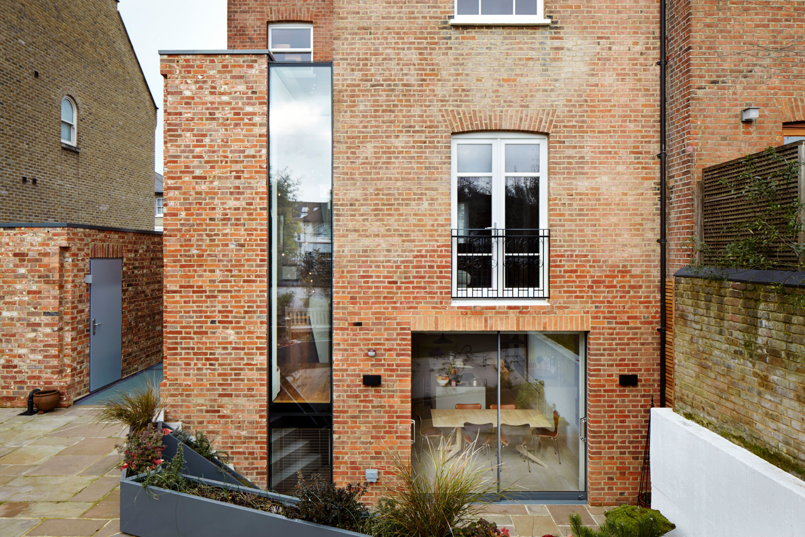 Daytime view from the garden Fraher and Findlay Rumah Modern