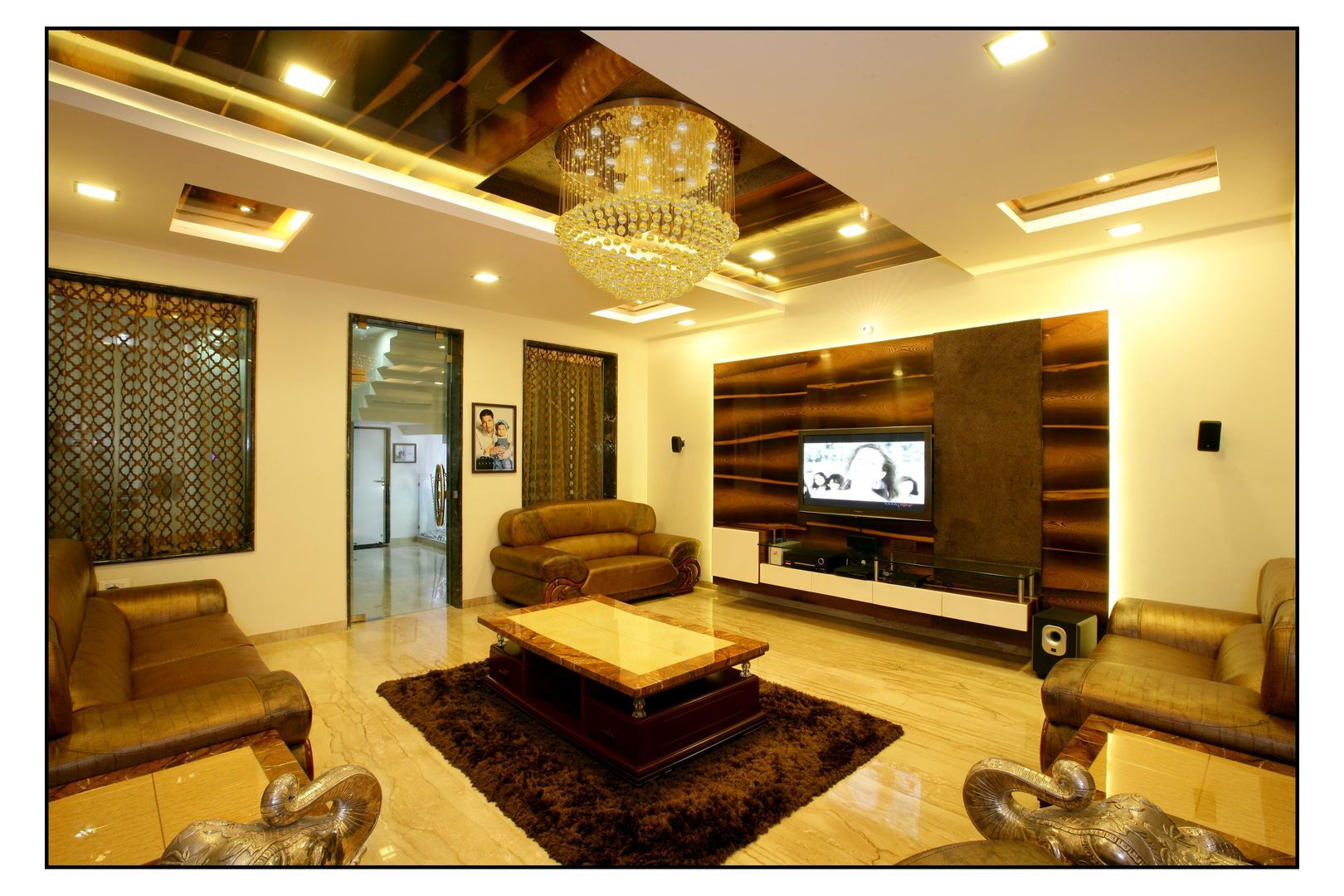 Living room sayyam interiors. غرفة المعيشة خشب Wood effect خزانات التلفزيون الجانبية